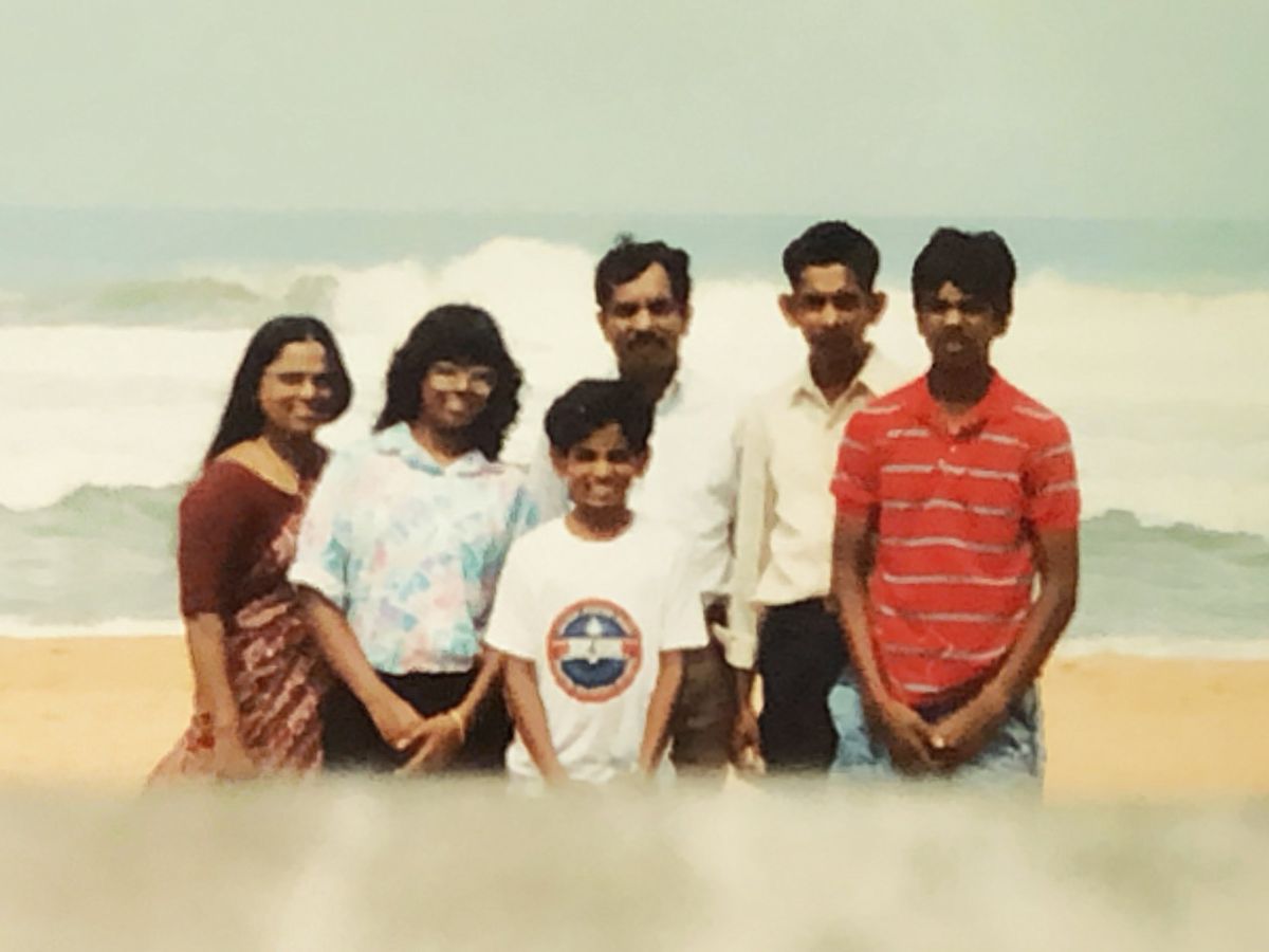 Mathew, Mary, John and their children at a beach in India